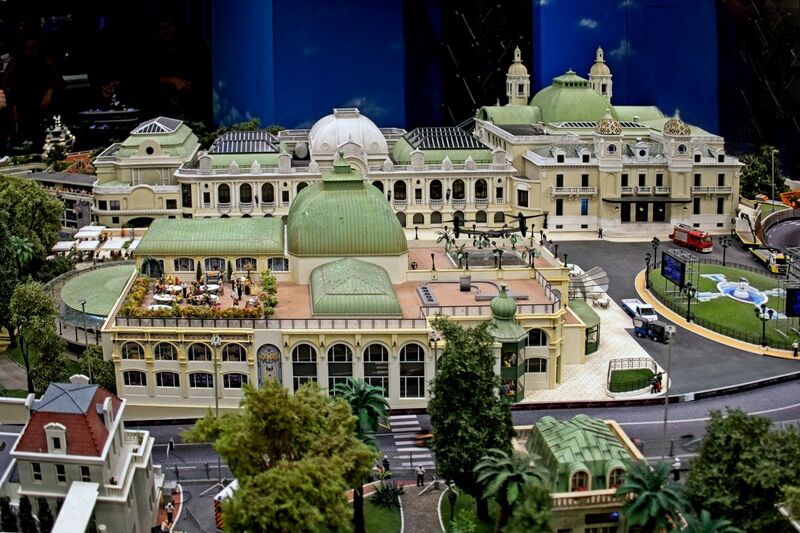 DC 25-0767-015.jpg :: Miniatur Wunderland Hamburg, Germany: The Miniatur Wunderland is, according to Guinness World Records, the largest model railway system in the world. It is located at the historic Speicherstadt in Hamburg and is one of the most popular and most visited sights in Germany. The exhibition includes around 1,230 digitally controlled trains with more than 12,000 wagons. The Wonderland is also designed with around 4,300 houses and bridges, more than 10,000 vehicles – of which around 350 drive independently on the installation – 47 airplanes and around 290,000 figures. The system features a recurring day-night lighting cycle and almost 500,000 built-in LED lights. Of the 7,000 m2 (75,347 sq ft) of floorspace, the models occupy 1,545 m2 (16,630 sq ft). P.s. Part of the Monaco section of the exhibition, Casino Square and race track. Photo taken 20/01/2025