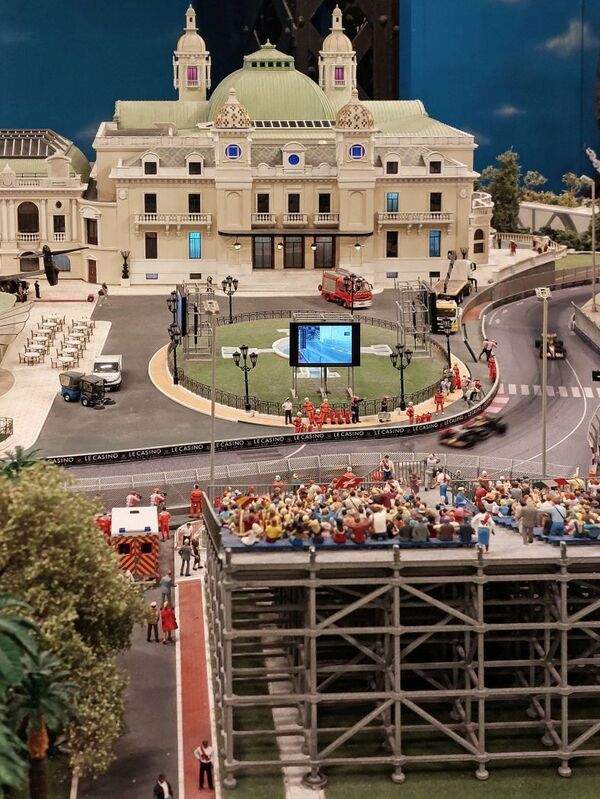 DC 25-0767-018.jpg :: Miniatur Wunderland Hamburg, Germany: The Miniatur Wunderland is, according to Guinness World Records, the largest model railway system in the world. It is located at the historic Speicherstadt in Hamburg and is one of the most popular and most visited sights in Germany. The exhibition includes around 1,230 digitally controlled trains with more than 12,000 wagons. The Wonderland is also designed with around 4,300 houses and bridges, more than 10,000 vehicles – of which around 350 drive independently on the installation – 47 airplanes and around 290,000 figures. The system features a recurring day-night lighting cycle and almost 500,000 built-in LED lights. Of the 7,000 m2 (75,347 sq ft) of floorspace, the models occupy 1,545 m2 (16,630 sq ft). P.s. Part of the Monaco section of the exhibition, Casino Square and race track. Photo taken 20/01/2025