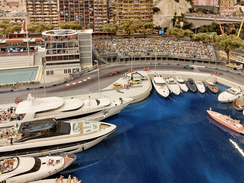 DC 25-0767-040.jpg :: Miniatur Wunderland Hamburg, Germany: The Miniatur Wunderland is, according to Guinness World Records, the largest model railway system in the world. It is located at the historic Speicherstadt in Hamburg and is one of the most popular and most visited sights in Germany. The exhibition includes around 1,230 digitally controlled trains with more than 12,000 wagons. The Wonderland is also designed with around 4,300 houses and bridges, more than 10,000 vehicles – of which around 350 drive independently on the installation – 47 airplanes and around 290,000 figures. The system features a recurring day-night lighting cycle and almost 500,000 built-in LED lights. Of the 7,000 m2 (75,347 sq ft) of floorspace, the models occupy 1,545 m2 (16,630 sq ft). P.s. Part of the Monaco section of the exhibition, Formula 1 circuit, Louis Chiron leading to the swimming pool complex. Photo taken 20/01/2025