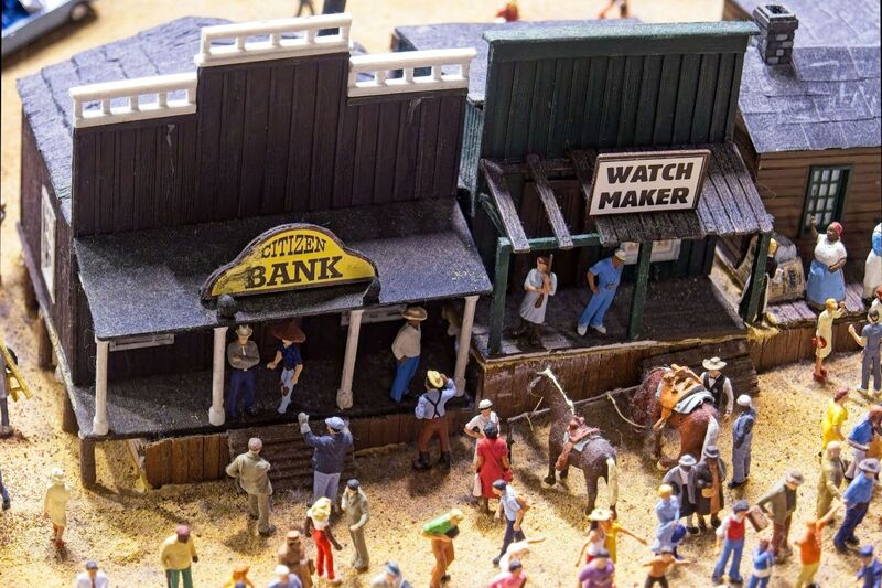 DC 25-0767-045.jpg :: Miniatur Wunderland Hamburg, Germany: The Miniatur Wunderland is, according to Guinness World Records, the largest model railway system in the world. It is located at the historic Speicherstadt in Hamburg and is one of the most popular and most visited sights in Germany. The exhibition includes around 1,230 digitally controlled trains with more than 12,000 wagons. The Wonderland is also designed with around 4,300 houses and bridges, more than 10,000 vehicles – of which around 350 drive independently on the installation – 47 airplanes and around 290,000 figures. The system features a recurring day-night lighting cycle and almost 500,000 built-in LED lights. Of the 7,000 m2 (75,347 sq ft) of floorspace, the models occupy 1,545 m2 (16,630 sq ft). P.s. Part of the USA section of the exhibition, The Western Village in the America section was a real ghost village, but now full life in the village is finally back to normal. Photo taken 20/01/2025