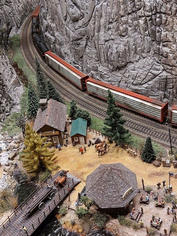 DC 25-0767-047.jpg :: Miniatur Wunderland Hamburg, Germany: The Miniatur Wunderland is, according to Guinness World Records, the largest model railway system in the world. It is located at the historic Speicherstadt in Hamburg and is one of the most popular and most visited sights in Germany. The exhibition includes around 1,230 digitally controlled trains with more than 12,000 wagons. The Wonderland is also designed with around 4,300 houses and bridges, more than 10,000 vehicles – of which around 350 drive independently on the installation – 47 airplanes and around 290,000 figures. The system features a recurring day-night lighting cycle and almost 500,000 built-in LED lights. Of the 7,000 m2 (75,347 sq ft) of floorspace, the models occupy 1,545 m2 (16,630 sq ft). Photo taken 20/01/2025