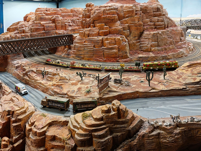 DC 25-0767-075.jpg :: Miniatur Wunderland Hamburg, Germany: The Miniatur Wunderland is, according to Guinness World Records, the largest model railway system in the world. It is located at the historic Speicherstadt in Hamburg and is one of the most popular and most visited sights in Germany. The exhibition includes around 1,230 digitally controlled trains with more than 12,000 wagons. The Wonderland is also designed with around 4,300 houses and bridges, more than 10,000 vehicles – of which around 350 drive independently on the installation – 47 airplanes and around 290,000 figures. The system features a recurring day-night lighting cycle and almost 500,000 built-in LED lights. Of the 7,000 m2 (75,347 sq ft) of floorspace, the models occupy 1,545 m2 (16,630 sq ft). P.s. Part of the USA section of the exhibition. Trestle Bridge. Photo taken 20/01/2025