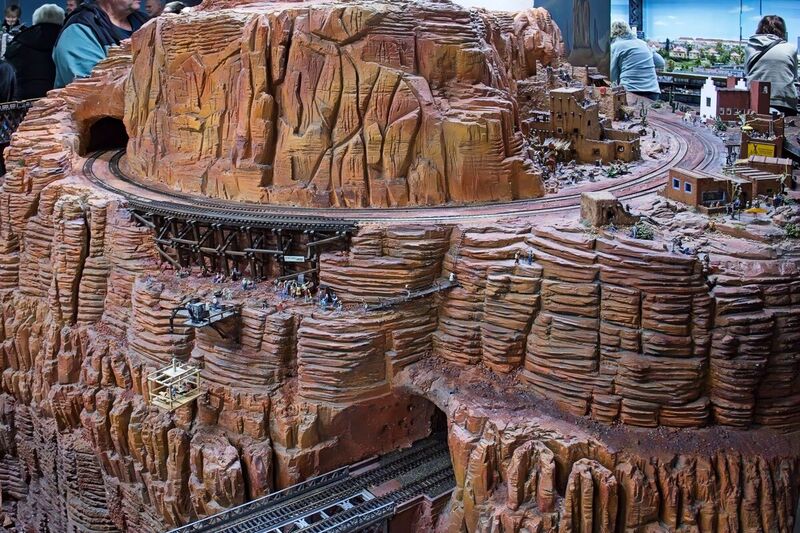 DC 25-0767-089.jpg :: Miniatur Wunderland Hamburg, Germany: The Miniatur Wunderland is, according to Guinness World Records, the largest model railway system in the world. It is located at the historic Speicherstadt in Hamburg and is one of the most popular and most visited sights in Germany. The exhibition includes around 1,230 digitally controlled trains with more than 12,000 wagons. The Wonderland is also designed with around 4,300 houses and bridges, more than 10,000 vehicles – of which around 350 drive independently on the installation – 47 airplanes and around 290,000 figures. The system features a recurring day-night lighting cycle and almost 500,000 built-in LED lights. Of the 7,000 m2 (75,347 sq ft) of floorspace, the models occupy 1,545 m2 (16,630 sq ft). P.s. Part of the USA section of the exhibition. Photo taken 20/01/2025