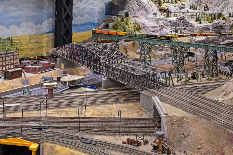 DC 25-0767-091.jpg :: Miniatur Wunderland Hamburg, Germany: The Miniatur Wunderland is, according to Guinness World Records, the largest model railway system in the world. It is located at the historic Speicherstadt in Hamburg and is one of the most popular and most visited sights in Germany. The exhibition includes around 1,230 digitally controlled trains with more than 12,000 wagons. The Wonderland is also designed with around 4,300 houses and bridges, more than 10,000 vehicles – of which around 350 drive independently on the installation – 47 airplanes and around 290,000 figures. The system features a recurring day-night lighting cycle and almost 500,000 built-in LED lights. Of the 7,000 m2 (75,347 sq ft) of floorspace, the models occupy 1,545 m2 (16,630 sq ft). P.s. Part of the USA section of the exhibition. Photo taken 20/01/2025