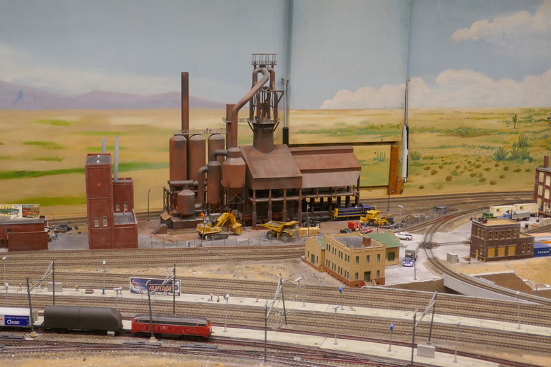 DC 25-0767-093.jpg :: Miniatur Wunderland Hamburg, Germany: The Miniatur Wunderland is, according to Guinness World Records, the largest model railway system in the world. It is located at the historic Speicherstadt in Hamburg and is one of the most popular and most visited sights in Germany. The exhibition includes around 1,230 digitally controlled trains with more than 12,000 wagons. The Wonderland is also designed with around 4,300 houses and bridges, more than 10,000 vehicles – of which around 350 drive independently on the installation – 47 airplanes and around 290,000 figures. The system features a recurring day-night lighting cycle and almost 500,000 built-in LED lights. Of the 7,000 m2 (75,347 sq ft) of floorspace, the models occupy 1,545 m2 (16,630 sq ft). P.s. Part of the USA section of the exhibition. Photo taken 20/01/2025