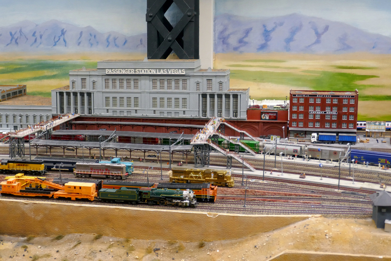 DC 25-0767-096.jpg :: Miniatur Wunderland Hamburg, Germany: The Miniatur Wunderland is, according to Guinness World Records, the largest model railway system in the world. It is located at the historic Speicherstadt in Hamburg and is one of the most popular and most visited sights in Germany. The exhibition includes around 1,230 digitally controlled trains with more than 12,000 wagons. The Wonderland is also designed with around 4,300 houses and bridges, more than 10,000 vehicles – of which around 350 drive independently on the installation – 47 airplanes and around 290,000 figures. The system features a recurring day-night lighting cycle and almost 500,000 built-in LED lights. Of the 7,000 m2 (75,347 sq ft) of floorspace, the models occupy 1,545 m2 (16,630 sq ft). P.s. Part of the USA section of the exhibition. Las Vegas Central Station. Fictional but a significant sector of the Wunderland with typical American architecture. Photo taken 20/01/2025