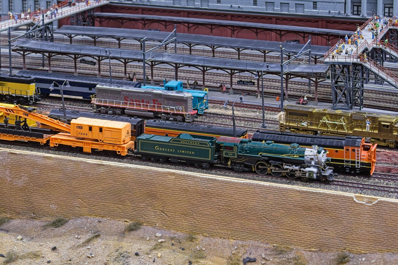 DC 25-0767-097.jpg :: Miniatur Wunderland Hamburg, Germany: The Miniatur Wunderland is, according to Guinness World Records, the largest model railway system in the world. It is located at the historic Speicherstadt in Hamburg and is one of the most popular and most visited sights in Germany. The exhibition includes around 1,230 digitally controlled trains with more than 12,000 wagons. The Wonderland is also designed with around 4,300 houses and bridges, more than 10,000 vehicles – of which around 350 drive independently on the installation – 47 airplanes and around 290,000 figures. The system features a recurring day-night lighting cycle and almost 500,000 built-in LED lights. Of the 7,000 m2 (75,347 sq ft) of floorspace, the models occupy 1,545 m2 (16,630 sq ft). P.s. Part of the USA section of the exhibition. Las Vegas Central Station. Trains in front of the fictional station. Photo taken 20/01/2025
