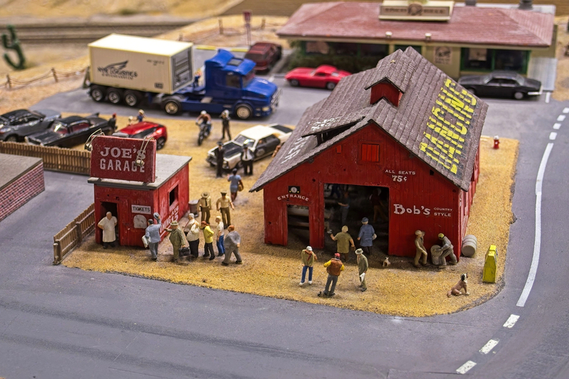 DC 25-0767-099.jpg :: Miniatur Wunderland Hamburg, Germany: The Miniatur Wunderland is, according to Guinness World Records, the largest model railway system in the world. It is located at the historic Speicherstadt in Hamburg and is one of the most popular and most visited sights in Germany. The exhibition includes around 1,230 digitally controlled trains with more than 12,000 wagons. The Wonderland is also designed with around 4,300 houses and bridges, more than 10,000 vehicles – of which around 350 drive independently on the installation – 47 airplanes and around 290,000 figures. The system features a recurring day-night lighting cycle and almost 500,000 built-in LED lights. Of the 7,000 m2 (75,347 sq ft) of floorspace, the models occupy 1,545 m2 (16,630 sq ft). P.s. Part of the USA section of the exhibition. Photo taken 20/01/2025