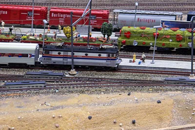 DC 25-0767-100.jpg :: Miniatur Wunderland Hamburg, Germany: The Miniatur Wunderland is, according to Guinness World Records, the largest model railway system in the world. It is located at the historic Speicherstadt in Hamburg and is one of the most popular and most visited sights in Germany. The exhibition includes around 1,230 digitally controlled trains with more than 12,000 wagons. The Wonderland is also designed with around 4,300 houses and bridges, more than 10,000 vehicles – of which around 350 drive independently on the installation – 47 airplanes and around 290,000 figures. The system features a recurring day-night lighting cycle and almost 500,000 built-in LED lights. Of the 7,000 m2 (75,347 sq ft) of floorspace, the models occupy 1,545 m2 (16,630 sq ft). P.s. Part of the USA section of the exhibition. Photo taken 20/01/2025