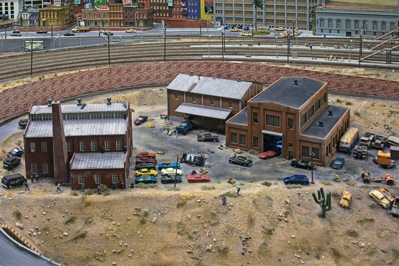 DC 25-0767-106.jpg :: Miniatur Wunderland Hamburg, Germany: The Miniatur Wunderland is, according to Guinness World Records, the largest model railway system in the world. It is located at the historic Speicherstadt in Hamburg and is one of the most popular and most visited sights in Germany. The exhibition includes around 1,230 digitally controlled trains with more than 12,000 wagons. The Wonderland is also designed with around 4,300 houses and bridges, more than 10,000 vehicles – of which around 350 drive independently on the installation – 47 airplanes and around 290,000 figures. The system features a recurring day-night lighting cycle and almost 500,000 built-in LED lights. Of the 7,000 m2 (75,347 sq ft) of floorspace, the models occupies 1,545 m2 (16,630 sq ft). P.s. Part of the USA section of the exhibition. Photo taken 20/01/2025