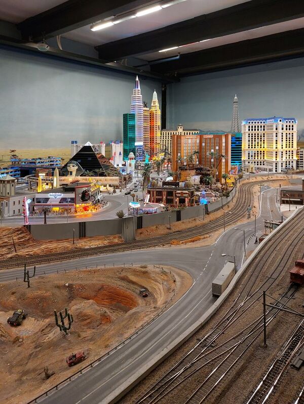 DC 25-0767-118.jpg :: Miniatur Wunderland Hamburg, Germany: The Miniatur Wunderland is, according to Guinness World Records, the largest model railway system in the world. It is located at the historic Speicherstadt in Hamburg and is one of the most popular and most visited sights in Germany. The exhibition includes around 1,230 digitally controlled trains with more than 12,000 wagons. The Wonderland is also designed with around 4,300 houses and bridges, more than 10,000 vehicles – of which around 350 drive independently on the installation – 47 airplanes and around 290,000 figures. The system features a recurring day-night lighting cycle and almost 500,000 built-in LED lights. Of the 7,000 m2 (75,347 sq ft) of floorspace, the models occupy 1,545 m2 (16,630 sq ft). P.s. Part of the USA section of the exhibition. Las Vegas Strip. Photo taken 20/01/2025