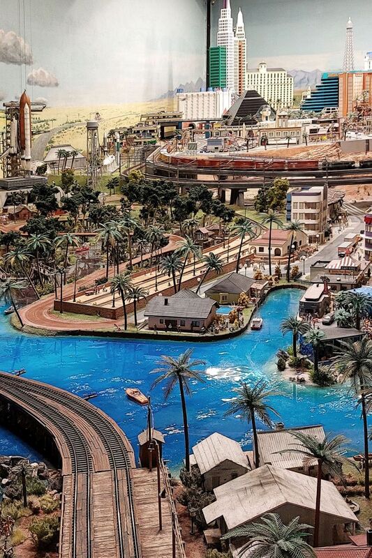 DC 25-0767-126.jpg :: Miniatur Wunderland Hamburg, Germany: The Miniatur Wunderland is, according to Guinness World Records, the largest model railway system in the world. It is located at the historic Speicherstadt in Hamburg and is one of the most popular and most visited sights in Germany. The exhibition includes around 1,230 digitally controlled trains with more than 12,000 wagons. The Wonderland is also designed with around 4,300 houses and bridges, more than 10,000 vehicles – of which around 350 drive independently on the installation – 47 airplanes and around 290,000 figures. The system features a recurring day-night lighting cycle and almost 500,000 built-in LED lights. Of the 7,000 m2 (75,347 sq ft) of floorspace, the models occupy 1,545 m2 (16,630 sq ft). P.s. Part of the USA section of the exhibition. Miami's, South Beach. Photo taken 20/01/2025