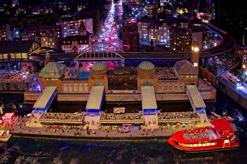 DC 25-0767-131.jpg :: Miniatur Wunderland Hamburg, Germany: The Miniatur Wunderland is, according to Guinness World Records, the largest model railway system in the world. It is located at the historic Speicherstadt in Hamburg and is one of the most popular and most visited sights in Germany. The exhibition includes around 1,230 digitally controlled trains with more than 12,000 wagons. The Wonderland is also designed with around 4,300 houses and bridges, more than 10,000 vehicles – of which around 350 drive independently on the installation – 47 airplanes and around 290,000 figures. The system features a recurring day-night lighting cycle and almost 500,000 built-in LED lights. Of the 7,000 m2 (75,347 sq ft) of floorspace, the models occupy 1,545 m2 (16,630 sq ft). P.s. Part of the Germany section of the exhibition. Hamburg. St. Pauli Piers. Photo taken 20/01/2025