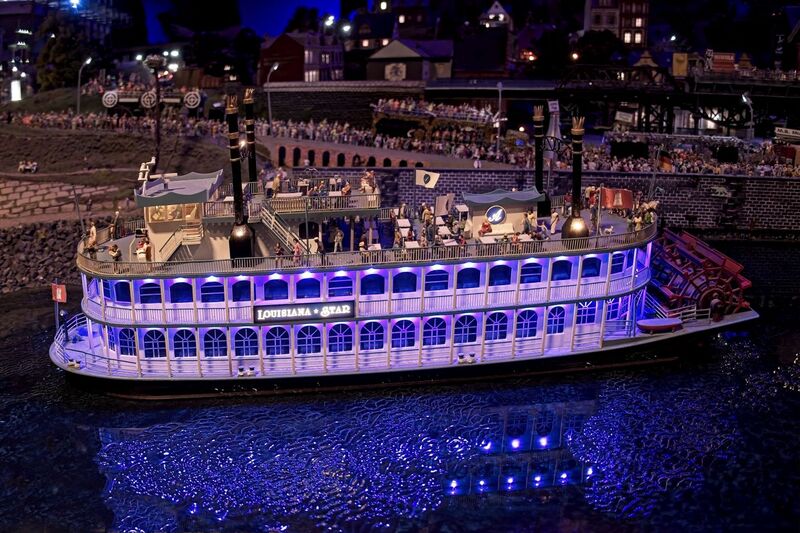 DC 25-0767-134.jpg :: Miniatur Wunderland Hamburg, Germany: The Miniatur Wunderland is, according to Guinness World Records, the largest model railway system in the world. It is located at the historic Speicherstadt in Hamburg and is one of the most popular and most visited sights in Germany. The exhibition includes around 1,230 digitally controlled trains with more than 12,000 wagons. The Wonderland is also designed with around 4,300 houses and bridges, more than 10,000 vehicles – of which around 350 drive independently on the installation – 47 airplanes and around 290,000 figures. The system features a recurring day-night lighting cycle and almost 500,000 built-in LED lights. Of the 7,000 m2 (75,347 sq ft) of floorspace, the models occupy 1,545 m2 (16,630 sq ft). P.s. Part of the Germany section of the exhibition. The Louisiana Star, old paddle steamer in the Port of Hamburg. Photo taken 20/01/2025