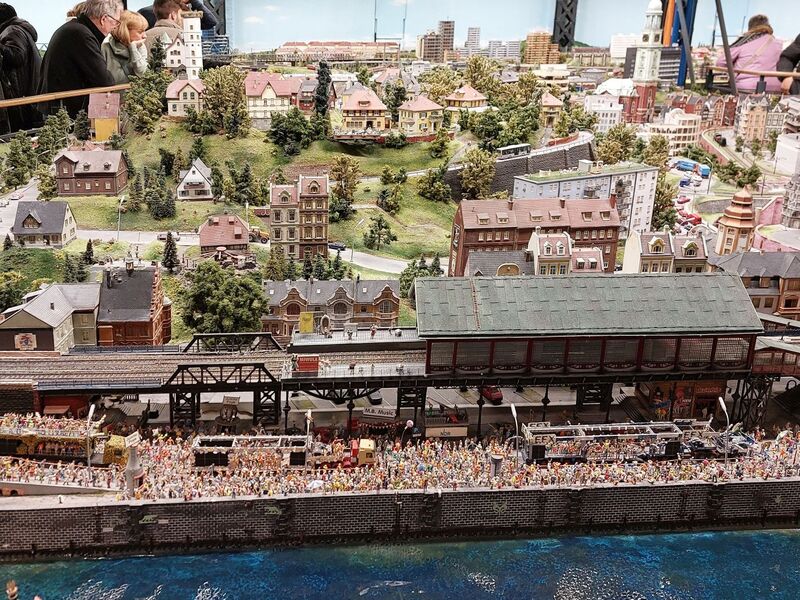 DC 25-0767-136.jpg :: Miniatur Wunderland Hamburg, Germany: The Miniatur Wunderland is, according to Guinness World Records, the largest model railway system in the world. It is located at the historic Speicherstadt in Hamburg and is one of the most popular and most visited sights in Germany. The exhibition includes around 1,230 digitally controlled trains with more than 12,000 wagons. The Wonderland is also designed with around 4,300 houses and bridges, more than 10,000 vehicles – of which around 350 drive independently on the installation – 47 airplanes and around 290,000 figures. The system features a recurring day-night lighting cycle and almost 500,000 built-in LED lights. Of the 7,000 m2 (75,347 sq ft) of floorspace, the models occupy 1,545 m2 (16,630 sq ft). P.s. Part of the Germany section of the exhibition. Hamburg. Photo taken 20/01/2025