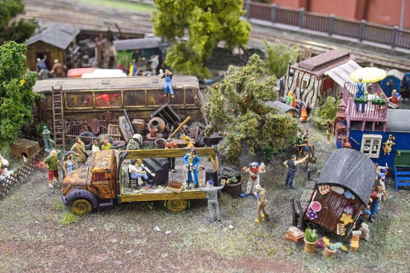 DC 25-0767-148.jpg :: Miniatur Wunderland Hamburg, Germany: The Miniatur Wunderland is, according to Guinness World Records, the largest model railway system in the world. It is located at the historic Speicherstadt in Hamburg and is one of the most popular and most visited sights in Germany. The exhibition includes around 1,230 digitally controlled trains with more than 12,000 wagons. The Wonderland is also designed with around 4,300 houses and bridges, more than 10,000 vehicles – of which around 350 drive independently on the installation – 47 airplanes and around 290,000 figures. The system features a recurring day-night lighting cycle and almost 500,000 built-in LED lights. Of the 7,000 m2 (75,347 sq ft) of floorspace, the models occupies 1,545 m2 (16,630 sq ft). P.s. Part of the Germany section of the exhibition. A trailer park in the St. Pauli quarter in Hamburg was dubbed Bambule. Photo taken 20/01/2025.