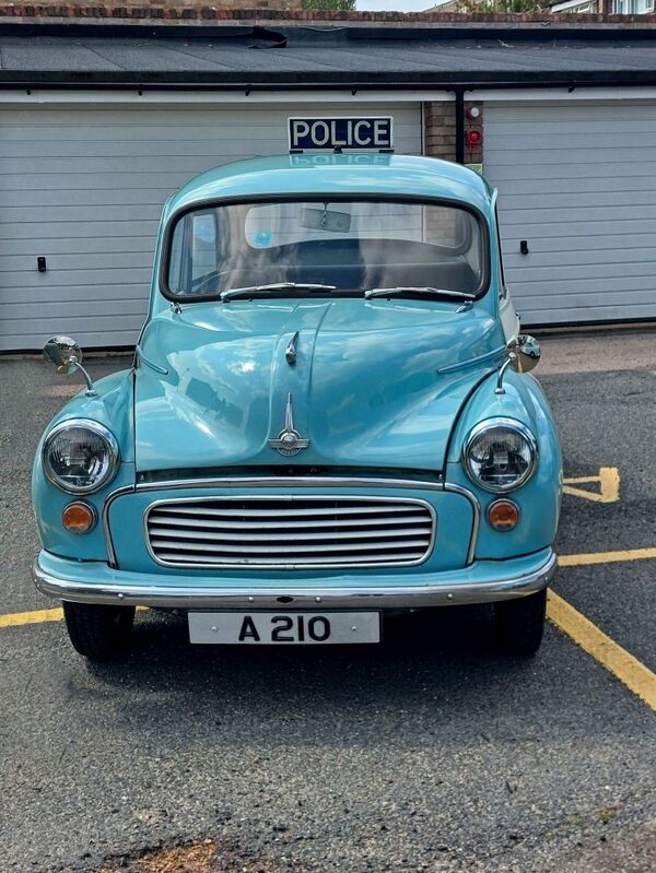 DC 25-0777-015.jpg :: Marlow House, Sidcup, Historic Police Cars Display: A Met Police 1970 Morris Minor 1000 Panda Car. Part of the Metropolitan Police Historic Vehicle Collection. This vehicle was used as a supervisor’s car to check on the beat officers and respond to calls. The aerial on the offside rear wing is an indicator that it wasn't an ordinary beat car. The white stripe across the roof that linked both doors is now missing on the later versions of Met Police Pandas, in order to reduce cost. Photo taken 08-06-2025