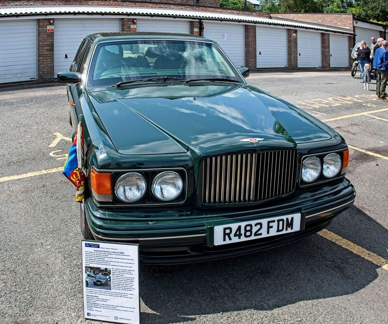 DC 25-0777-032.jpg :: Marlow House, Sidcup, Historic Police Cars Display: A Met Police 1997 Bentley Turbo TBO. Part of the Metropolitan Police Historic Vehicle Collection. This vehicle is the most recent addition to the fleet having been donated to the collection in 2012. This particular Bentley has been used by the MPS Royalty Protection unit since it was purchased. The significance of this particular vehicle is that it was used daily as Prince Charles Armoured escort car. This vehicle is heavily armoured and equipped to protect the Royal Family. The vehicle is armour plated all around top bottom and all doors It also has 4-inch-thick bullet proof glass. Reg No. R482 FDM. Photo taken 08-06-2025