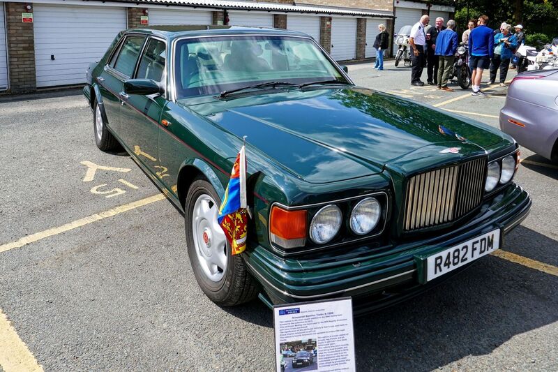 DC 25-0777-034.jpg :: Marlow House, Sidcup, Historic Police Cars Display: A Met Police 1997 Bentley Turbo TBO. Part of the Metropolitan Police Historic Vehicle Collection. This vehicle is the most recent addition to the fleet having been donated to the collection in 2012. This particular Bentley has been used by the MPS Royalty Protection unit since it was purchased. The significance of this particular vehicle is that it was used daily as Prince Charles Armoured escort car. This vehicle is heavily armoured and equipped to protect the Royal Family. The vehicle is armour plated all around top bottom and all doors It also has 4-inch-thick bullet proof glass. Reg No. R482 FDM. Photo taken 08-06-2025