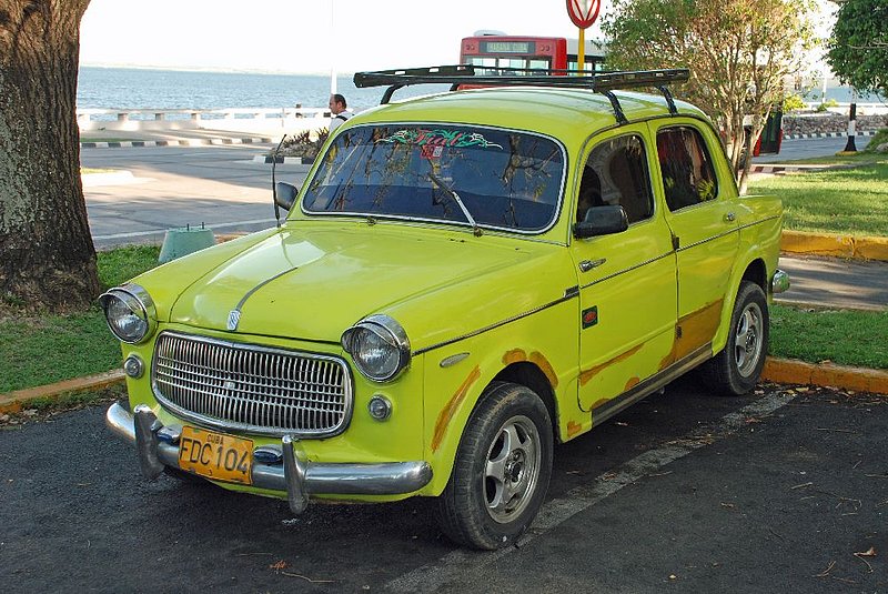 DC 11-0240-064.jpg :: 2011 - Cuban Classic Cars - 1959 Fiat 1100 Millicento. Seen outside the Hotel Gran Caribe Jagua in Cienfuegos. Reg No. FDC 104 on yellow Cuban plate. 01/06/2011  
