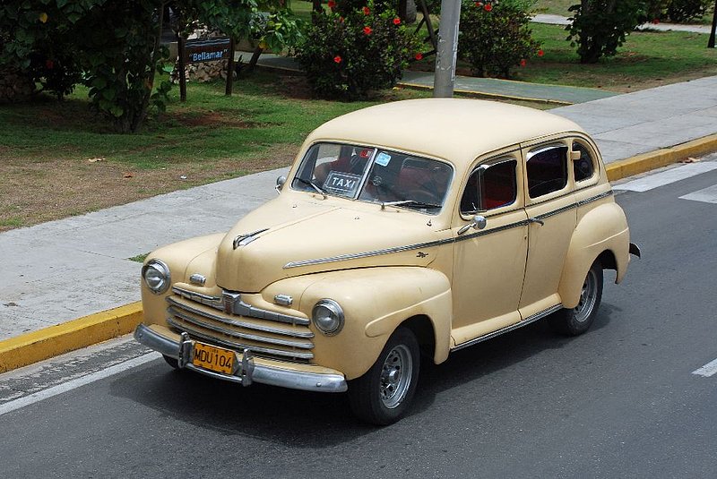 DC 11-0240-103.jpg :: 2011 - Cuban Classic Cars - 1946 Ford Deluxe. Seen driving along the main road running through Varadero. Reg. No. MDU 104 on a Yellow Cuban plate. 04/06/2011  
