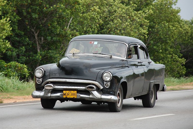 DC 11-0240-111.jpg :: 2011 - Cuban Classic Cars - 1953 Oldsmobile Super 88 Four Door Sedan. Seen driving along the main road running through Varadero. Reg. No. MDR 386 on a Yellow Cuban plate. 03/06/2011  
