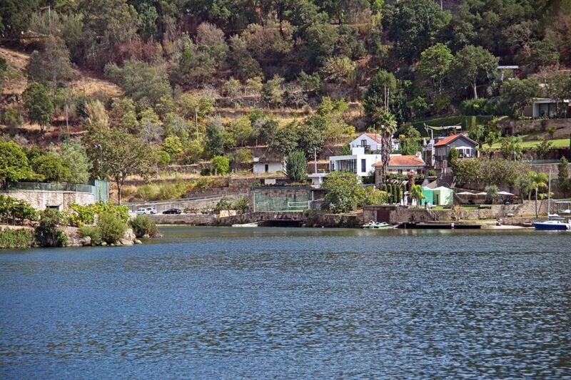 DC 22-0654-102.jpg :: Saga Douro River Cruise, Porto to Regua Lamego, River Douro: Early morning aboard the MS Douro Spirit departing Porto to Lamego. Embankment scenery on route to Lamego, passing Paços de Gaiolo in the Municipality of Marco de Canaveses. Photo taken 30/08/2022