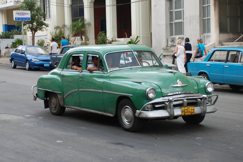 DC 11-0240-001.jpg :: 2011 - Cuban Classic Cars - 1951 Plymouth Cranbrook outside the Hotel Tryp Habana Libre in Havana. These American dream cars are common all over Cuba. There is no suggestion that the car is in its original condition as these cars are kept running using all sorts or suitable spares and non original components. The chances are the engines are either Japanese or Russian. Reg. No. HEB 422 on a yellow cuban plate. 26/05/2011  
