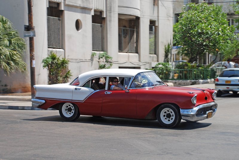 DC 11-0240-016.jpg :: 2011 - Cuban Classic Cars - 1957 Oldsmobile Super 88 sedan outside the Hotel Tryp Habana Libre in Havana. These American dream cars are common all over Cuba. There is no suggestion that the car is in its original condition as these cars are kept running using all sorts or suitable spares and non original components. The chances are the engines are either Japanese or Russian.  26/05/2011  
