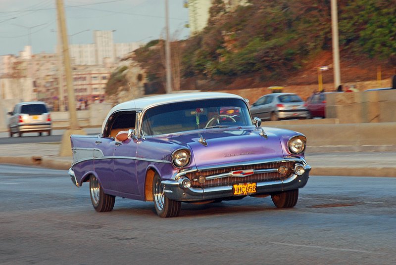 DC 11-0240-023.jpg :: 2011 - Cuban Classic Cars - 1954 Chevrolet Bel Air sedan driving along the Malecon in Havana. These American dream cars are common all over Cuba. There is no suggestion that the car is in its original condition as these cars are kept running using all sorts or suitable spares and non original components. The chances are the engines are either Japanese or Russian. Reg. No. HHC 856 on a yellow Cuban plate. 29/05/2011  
