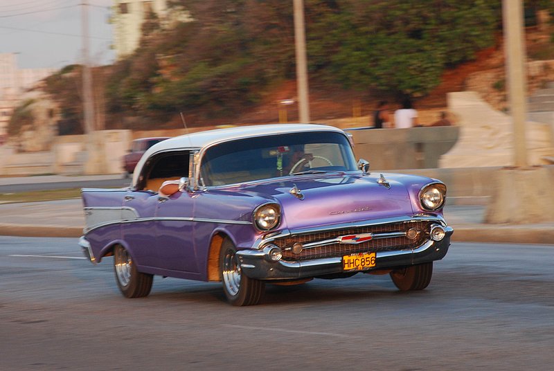 DC 11-0240-024.jpg :: 2011 - Cuban Classic Cars - 1954 Chevrolet Bel Air sedan driving along the Malecon in Havana. These American dream cars are common all over Cuba. There is no suggestion that the car is in its original condition as these cars are kept running using all sorts or suitable spares and non original components. The chances are the engines are either Japanese or Russian. Reg. No. HHC 856 on a yellow Cuban plate. 29/05/2011  
