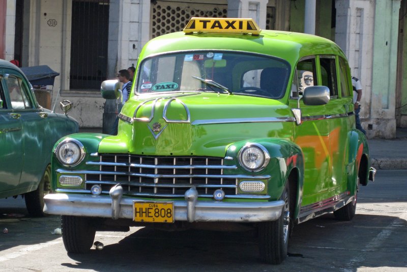 DC 11-0240-033.jpg :: 2011 - Cuban Classic Cars - 1947 Cadillac Limousine outside the Capital Building in Havana. These American dream cars are common all over Cuba. There is no suggestion that the car is in its original condition as these cars are kept running using all sorts or suitable spares and non original components. The chances are the engines are either Japanese or Russian. Reg. No. HHE 808 on a yellow Cuban plate. 26/05/2011  
