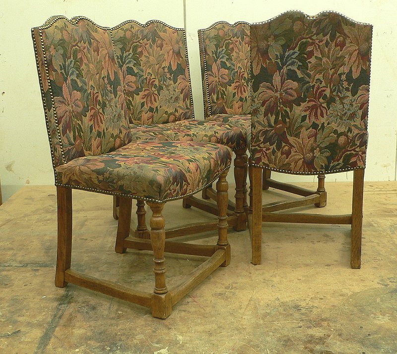 Set of four Victorian Tudor style oak dining chairs.jpg