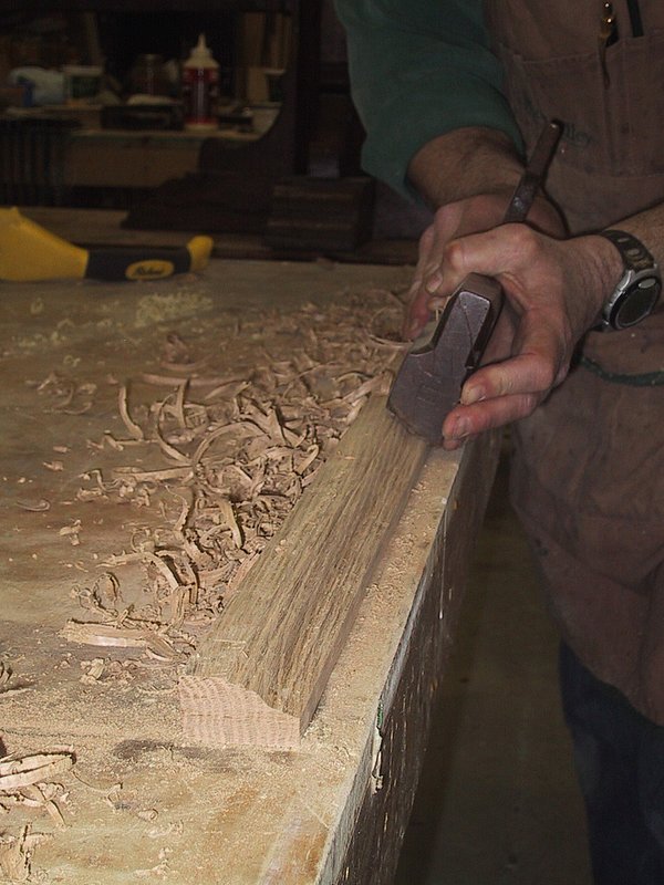 Using 18th century plane to create moulding.jpg