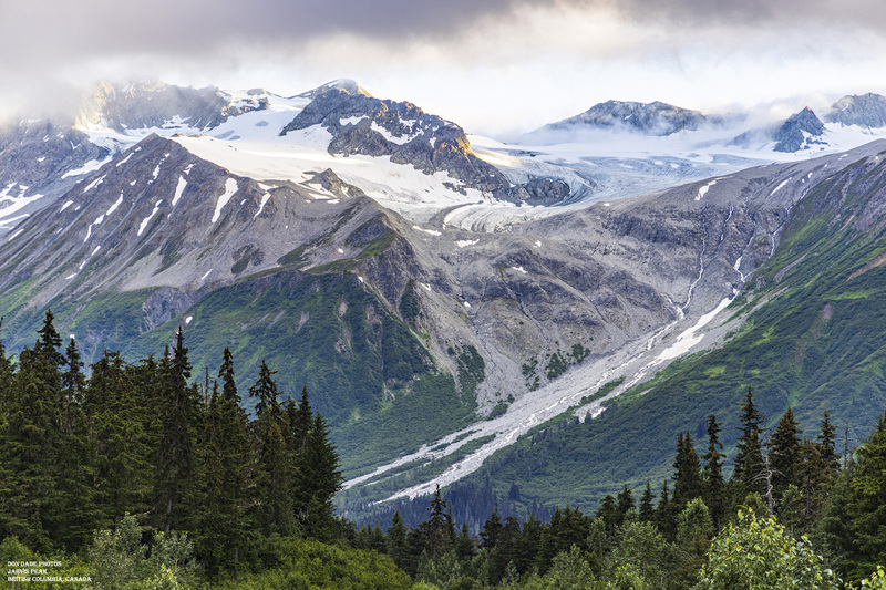Jarvis Peak British Columbia.jpg :: Jarvis Peak is located about an hour northwest of Haines Alaska in British Columbia and is quite a site to see as you come down the Haines Highway.
The swirling of the Glacier Ice, the sun cutting through the clouds hitting the peaks of the mountain above the tree line was spectacular.