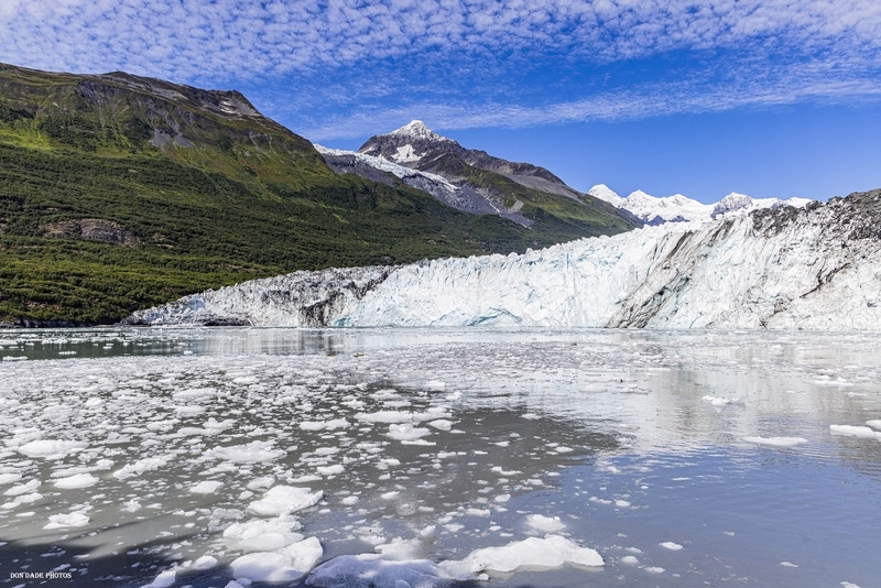Where Ice Meets the Water.jpg :: The Harvard Glacier located at the head of the College Fjord in the Prince William Sound, Alaska.
It is one of the few advancing glaciers.
It is one of the premier stops on the 26 glaciers tour out of Whittier Alaska.
We are sitting a couple miles out into the ice pack
Very cool location set back to see the contrast of the green forest
Next to the face of the blue ice glacier
The blue sky and the clouds that seem to mirror the jagged edges of ice below.