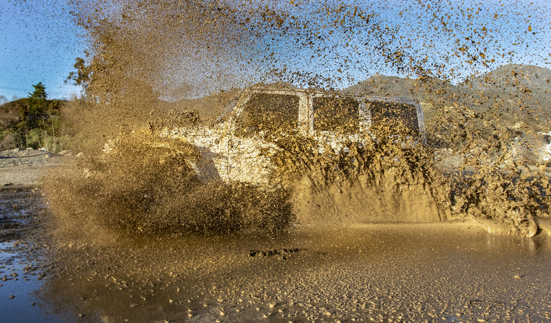 A 4x4 Plowing through mud puddle trabucco canyoun California0042019 jeep mud008.jpg :: Jeep 4x4 plowing through mud puddle with mud flying Trabucco Canyoun Ca