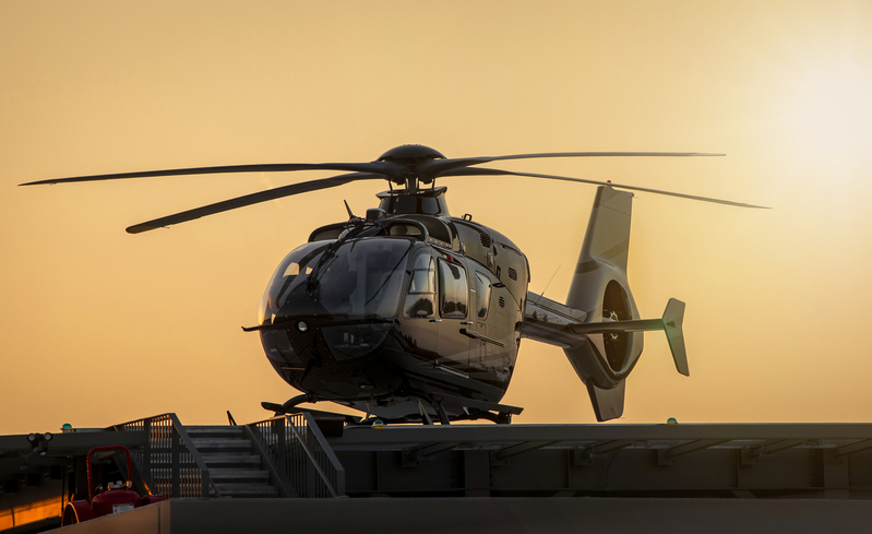 Black Helicopter on Pad at Sunset001C.jpg :: Black Helicopter tied down on platform at sunset