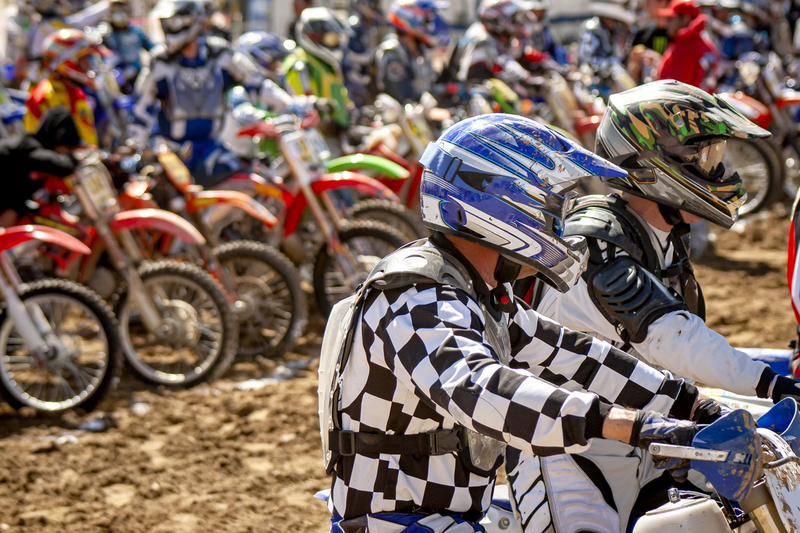 Image of two motorcycle riders ready to race with other riders in the background002.jpg :: Image of two motorcycle riders ready to race with other riders in the background