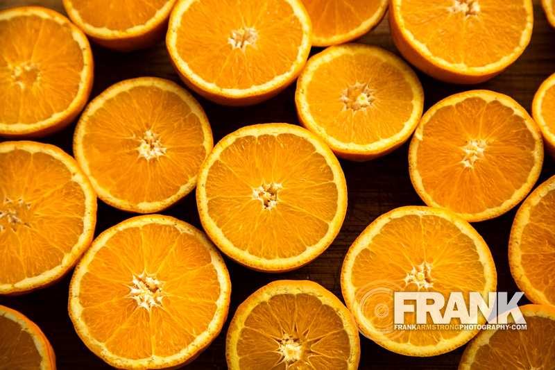Overhead close up of oranges cut in half 001LOGO.jpg :: Overhead close up of oranges cut in half