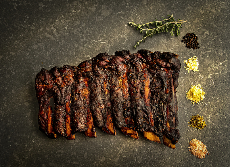 Slab of Beef Ribs with spices on granite 003_3A(1).jpg :: Slab of Beef Ribs with spices on granite countertop