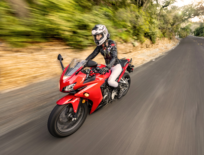 Woman on red road motorcycle driving fast though Trabuco Canyon CA 002A(1).jpg
