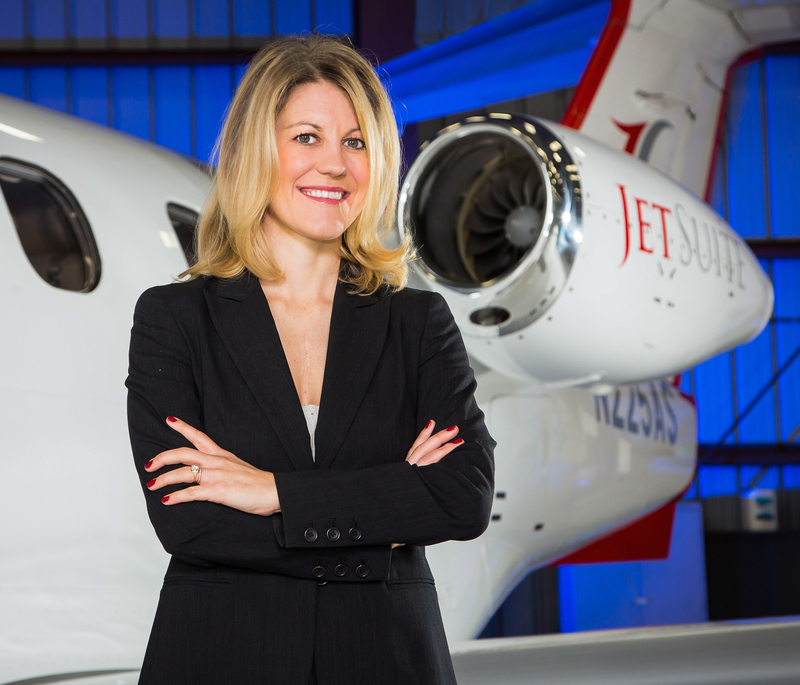 Woman standing next to a jet 001crop.jpg