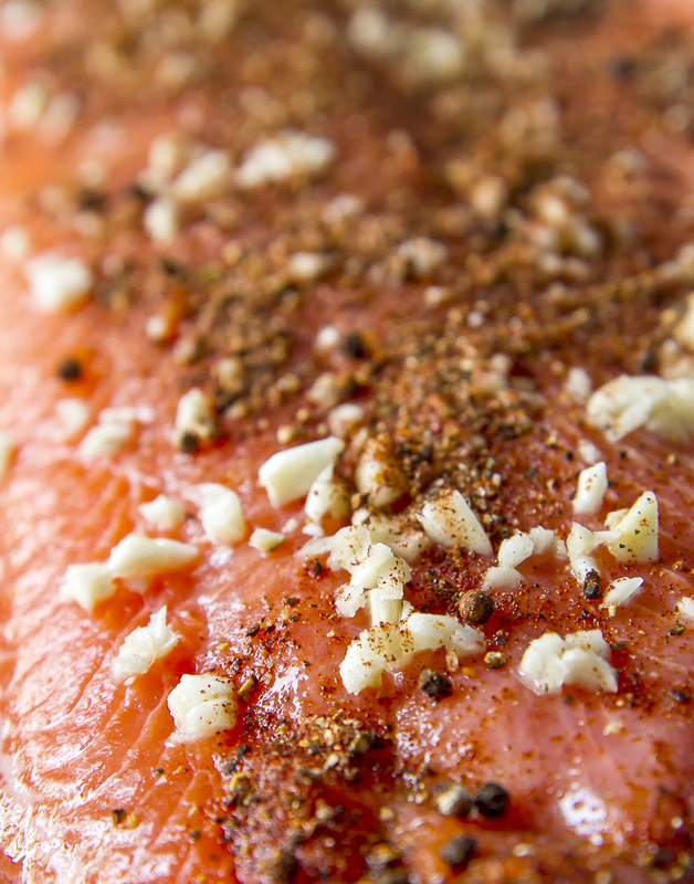 close up of Salmon with garlic clove rub prepared for cooking on BBQ 001.jpg :: Close up of Salmon with garlic clove rub prepared for BBQ