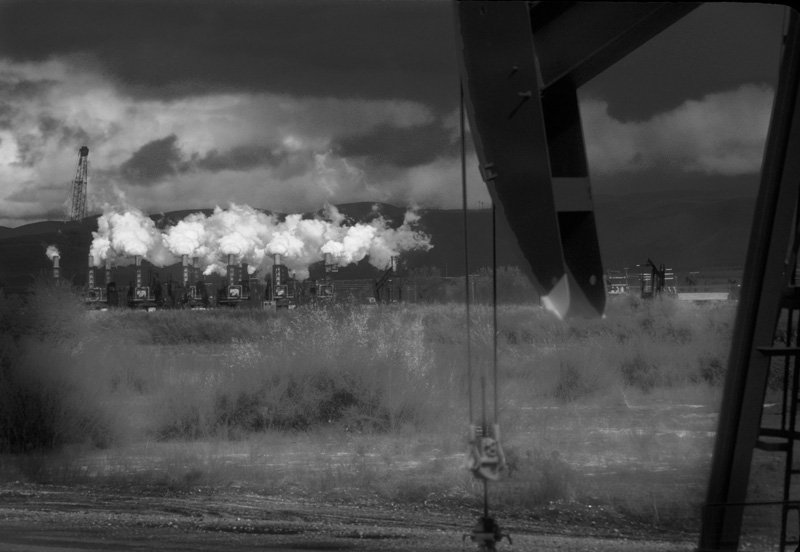 BW - Oil Wells.jpg :: Taken along Hwy 101 near San Luis Obispo, CA. The original was a 35mm slide and the colors really pop: deep blacks, blue sky, white clouds, etc. It was a bit too pretty in color and works much better in B&W.
