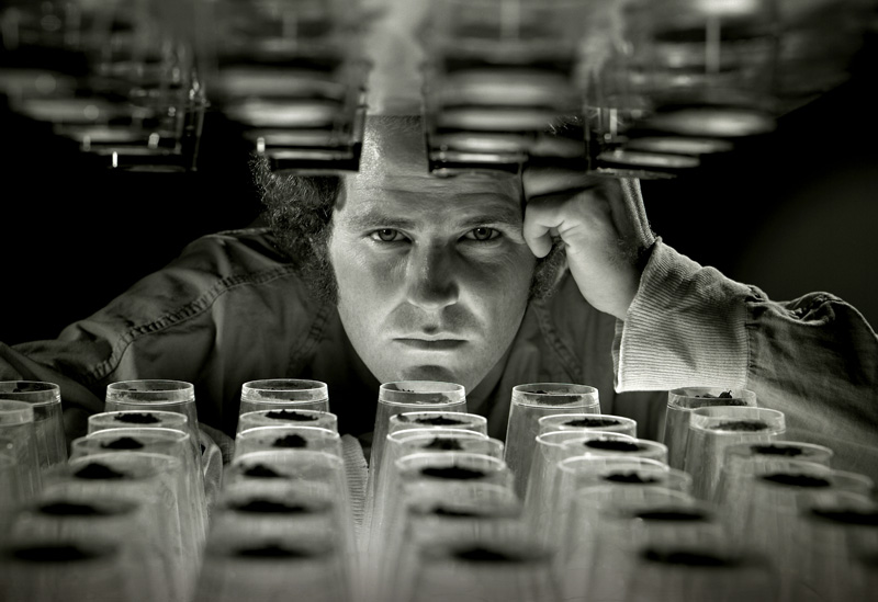 BW - Portrait - Scientist.jpg :: Took this shot for a class assignment while at Brooks Insitute. Shot on a 4x5 on B&W film with a multiple light setup. The strong perspective created by the rows of cups at the top and bottom of the image really draw the eye to the subject.