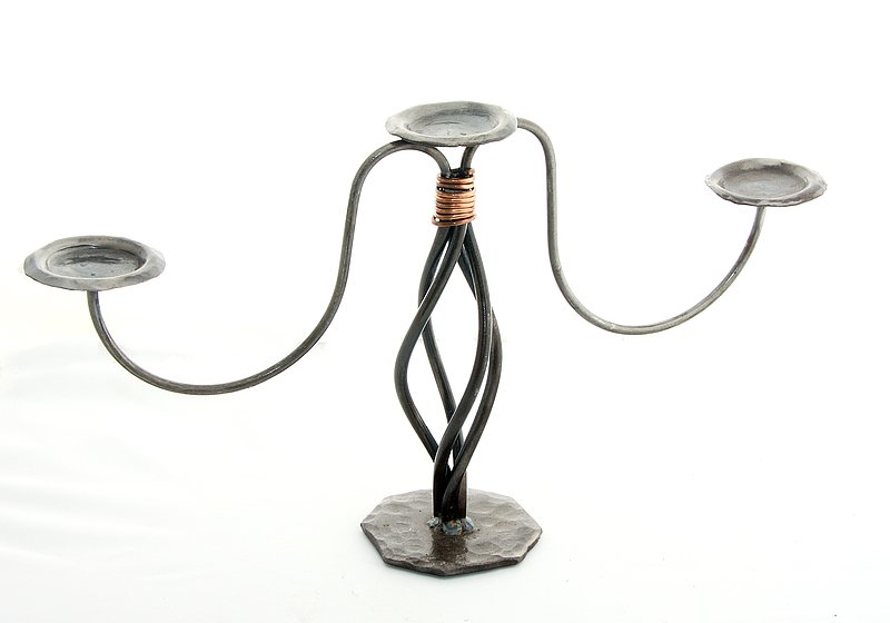 Candelabra 2.jpg :: $45.00 - This three-light candelabra can be used with votive cups or pillar candles. The bottom sits on a hammered base and has a copper wire binding to close off the top of the design. This candelabra is approx 12\