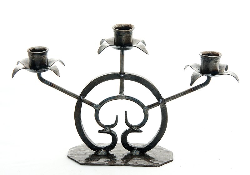 Candelabra 3.jpg :: $75.00 - This three-light candelabra features a repeated design which draws the eye dramatically to its center. The leaf-shaped candle holders work with votive or pillar candles. This candelabra is approx 12\