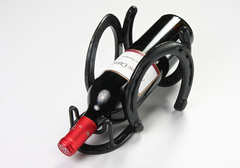 Horse Shoe Wine Rack-1.jpg :: This wine bottle holder is made with horseshoes and will hold a single bottle of wine.