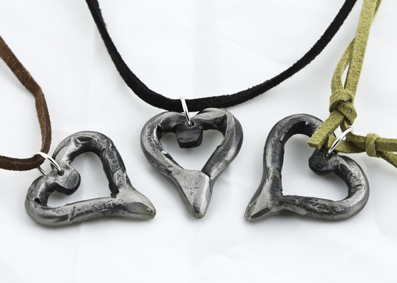 IMG_3714.jpg :: Sampling of iron heart shapes. These are  hand-forged in very high heat, then shaped and molded into a unique form, and ultimately left with rough edges that define their character. Hmmm, made just like love!